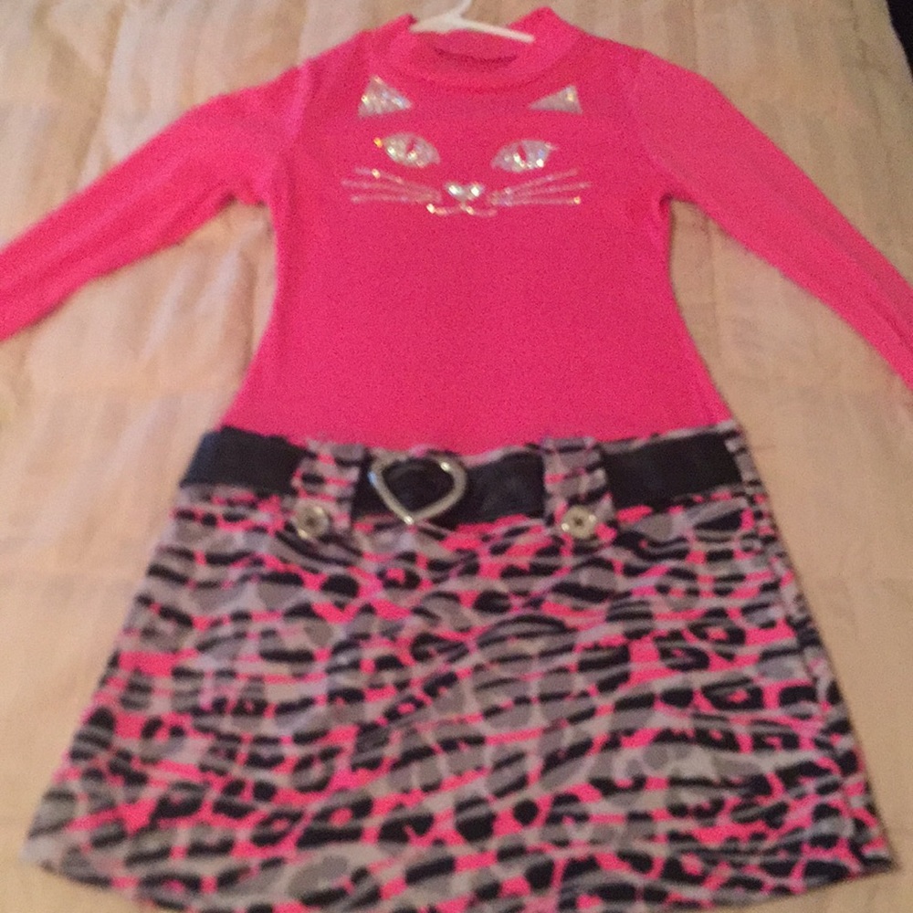A pink dress with a cat on front